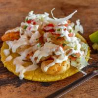 Taco Baja Shrimp · Ensenada style shrimp tacos topped off with cabbage, pico de gallo, and our house Baja dress...