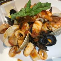 Linguine Monsignore · Squid-ink pasta, little neck clams, mussels, scallops, shrimp & calamari, marinara sauce