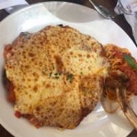 Veal Chop Parmigiana · pounded and breaded veal chop, topped with marinara sauce and melted mozzarella