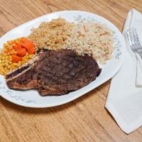 Rib Eye (boneless) Steak · Cooked to order, comes with choice of one side, corn & carrots, choice of sour of the day or...