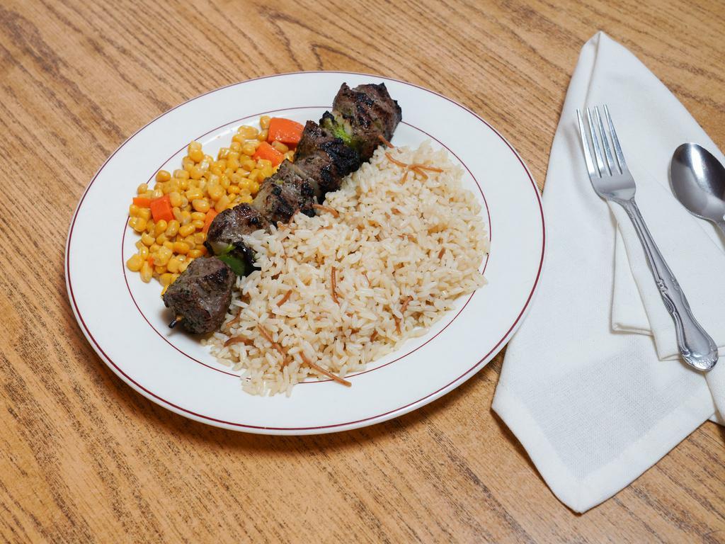 Shish Kabob Skewer · Signature Shish (lamb) with green bell peppers and yellow onions, with one side, corn & carrots medley, Salad or Soup, bread, and baklava.