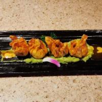Spicy Tuna Dumpling · Deep-fried spicy tuna dumplings with special sauce bottom with mashed avocados. Hot and spicy.