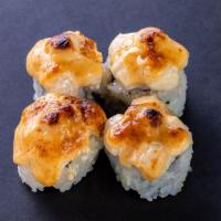 (f044) Dynamite Bay Scallop Roll · Four pieces. California roll. Topped with baked scallop and dynamite sauce.