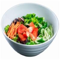 (g064) Green Salad · Mixed greens, carrots, cucumbers, tomatoes and ginger dressing.