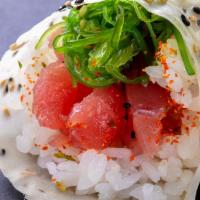 (c029) Tuna Poke Hand Roll · Tuna and seaweed salad, poke sauce and wrapped in soy paper.