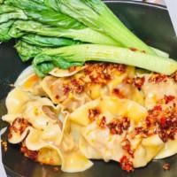 Pork Wonton Dumplings · Steamed wontons, with spicy chili sauce, and steamed bok choy (Spicy unless otherwise specif...