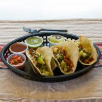 Mexican Tacos Style · 3 corn tortillas, choose your protein, cilantro, onions, salsa and limes.