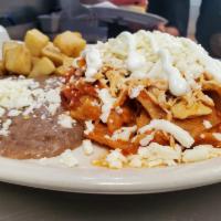 Chilaquiles with Chicken · Tortilla chips with sauce of your choice, queso fresco, sour cream and shredded chicken brea...