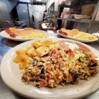 Machacado with Egg · Machacado meat mixed with eggs and pico de gallo, served with breakfast potatoes, refried be...