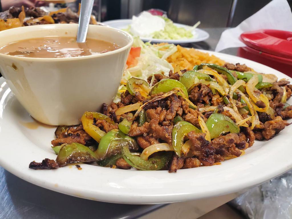 Pastor Plate · Pastor mixed with grilled onions and bell peppers, served with rice, refried beans and 2 tortillas.