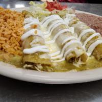 Enchiladas Verdes plate · 3 chicken enchiladas on corn tortillas, topped with Monterrey jack cheese melted with tomati...