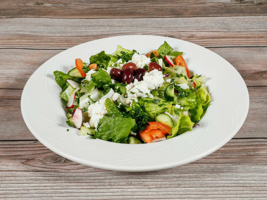 Magic Lamp Salad · Green leaf lettuce, tomato, cucumber, green onion, parsley, radish, mint, sumac, house dressing, olives, feta cheese. Vegetarian. Gluten free.