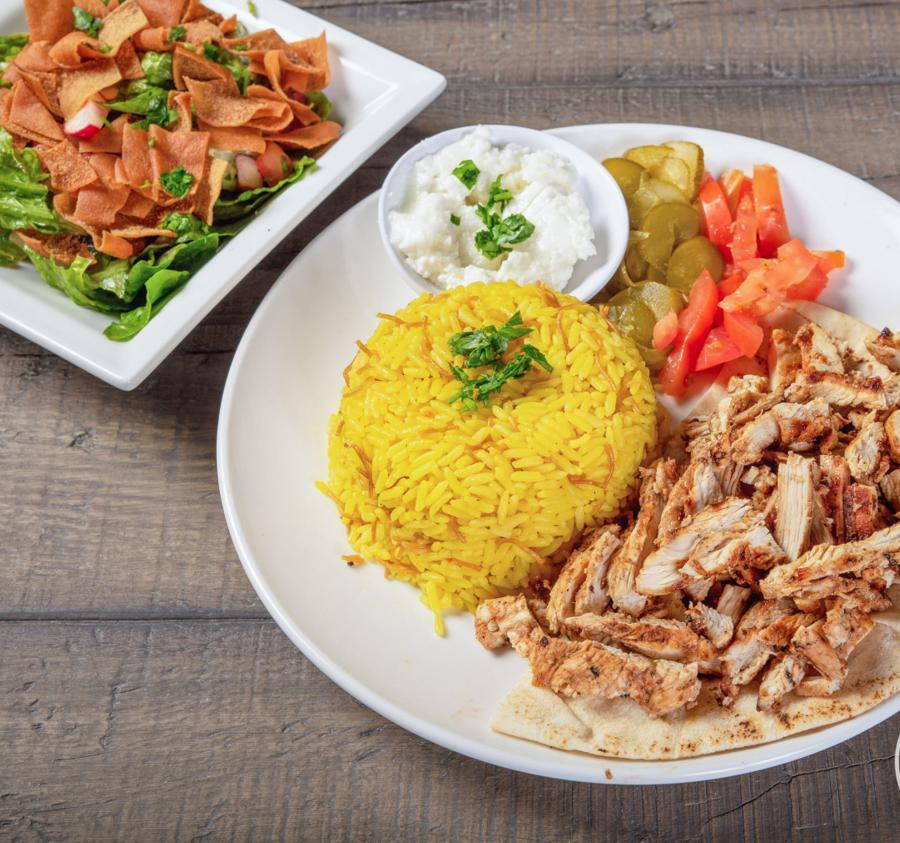 Chicken Shawarma Plate · Chicken breast sliced. served with garlic sauce, cucumber pickles and tomatoes.