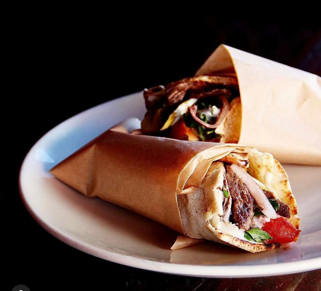Beef Kafta Sandwich · Prime ground beef and lamb, parsley, onion, sumac, spices, tomato, topped with lettuce. Add fattoush or rice for an additional charge.