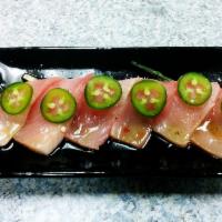 Hamachi jalapeno with Ponzu · Yellowtail sashimi with slice of jalapeno with ponzu sauce.