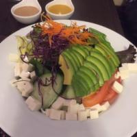 Tofu Avocado Salad · Sliced avocado with a variety of vegetables and tofu. 
