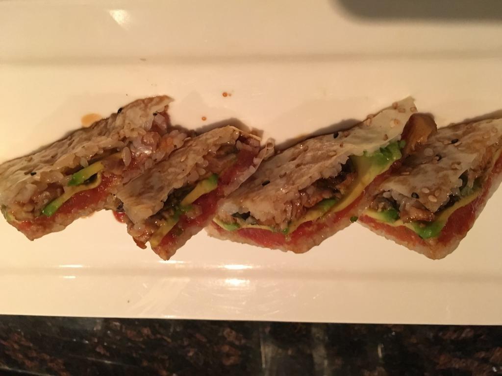 Sankakkei Sandwich · 4 triangle pieces of spicy tuna, eel, avocado and caviar wrapped with soybean paper.