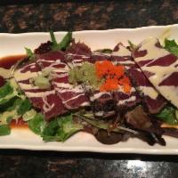Black Pepper Tuna Salad · Seared pepper tuna, spring mix salad and honey wasabi sauce.