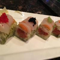 Miami Roll · Inside: spicy tuna, white tuna w. cucumber
Outside: Salmon, scallop, masago wrapped w. white...