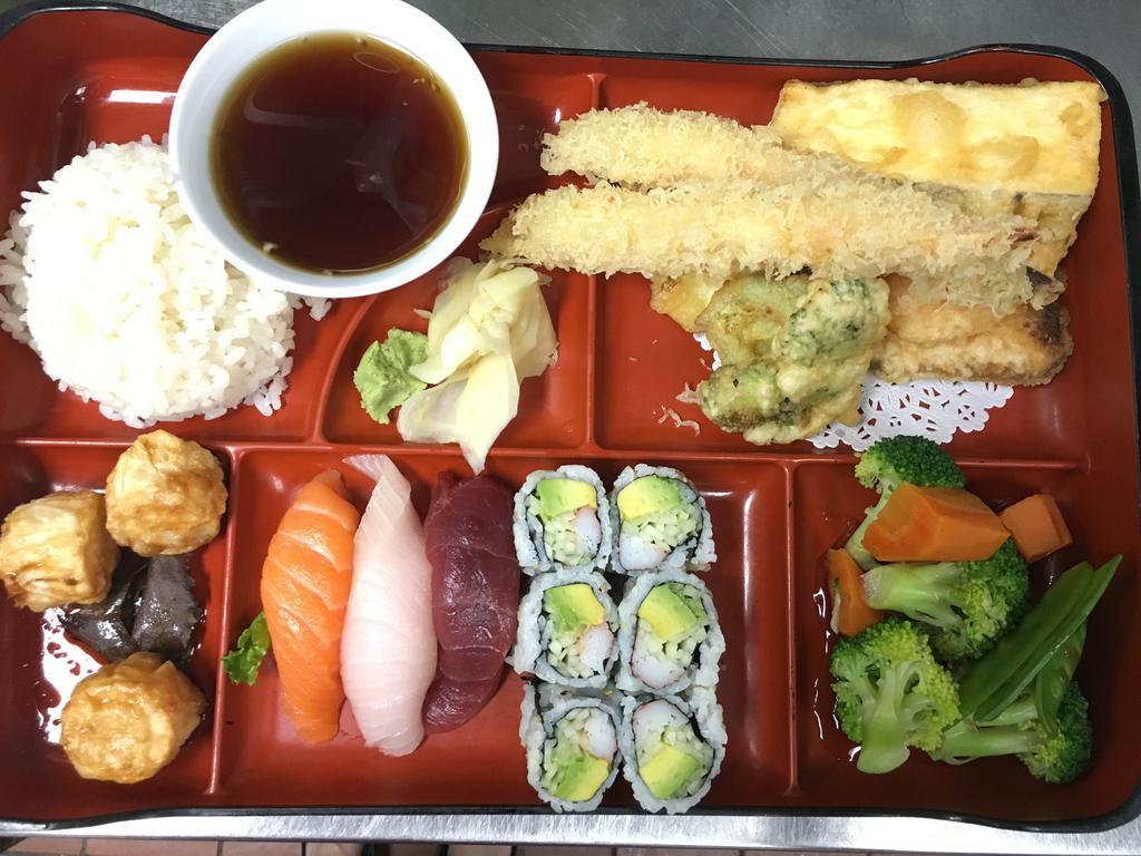Dinner Bento Box · White or brown rice, vegetable of the day, fried crab shumai, a California roll and 3 pieces of sushi with your choice of item.