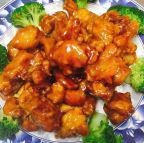 Orange Chicken · Tender crispy chicken glazed with a sweet tangy orange sauce. Served with steamed rice.