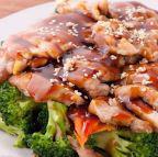 Teriyaki Chicken · Grilled chicken over steamed vegetables topped with house teriyaki sauce. Served with steamed rice.