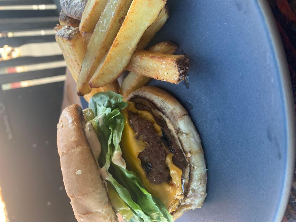 1/2 lb 3rd Wagyu Cheeseburger · butter bun, ramp spread, dirty girl tomato, little gem lettuce, pickles, steak fries