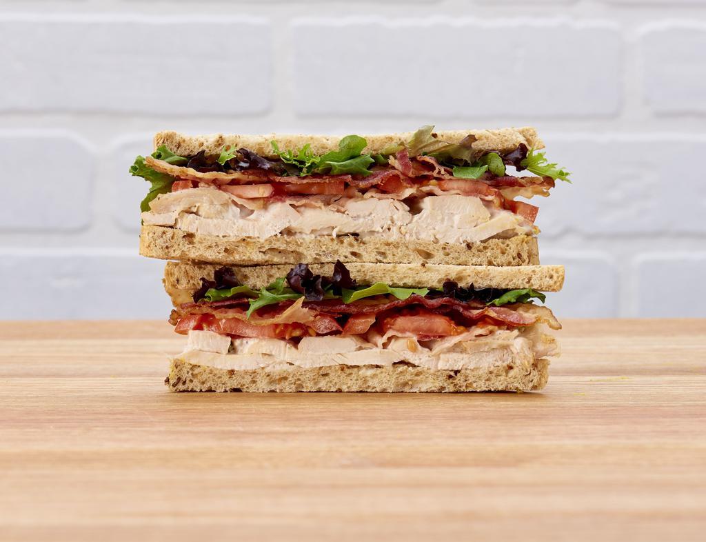 Chicken & Bacon Sandwich · Multi-grain bread filled with grilled chicken, crispy Niman Ranch bacon, sliced tomatoes and mesclun.