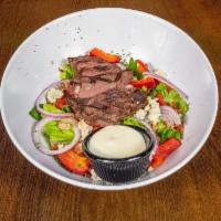 Tru Steak Salad · Seared black Angus top sirloin, blue cheese crumbles, bacon, grape tomatoes, red bell pepper...