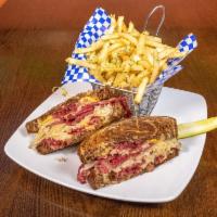 Hot Pastrami Sandwich · Warm pastrami, melted Swiss cheese topped with homemade sauerkraut and house mustard on marb...
