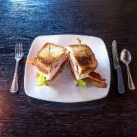 Club House Sandwich · Smoked turkey breast, black forest ham, applewood bacon, iceberg lettuce, tomatoes, Swiss ch...