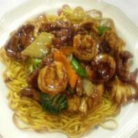 95. Pan Fried Noodle · With shrimp, chicken and beef with fresh vegetable in special brown sauce.