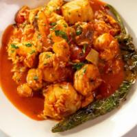 Spicy Jambalaya · sea scallops, shrimp, andouille sausage, chicken, tossed with rice in a fiery Louisiana toma...