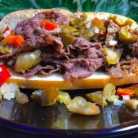 Dog in a Blanket (Italian Beef + Sausage of your choice) · Italian Beef, Choice of sausage, Sport Peppers, Provolone Cheese, Mild Giardiniera, Au jus