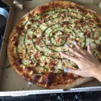 Slims Pizza · Chicken, Bacon, Tomato and Ranch with a swirl of pesto and no red sauce.