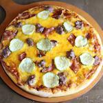 BBQ Bacon Cheese Pizza · BBQ sauce, ground beef, bacon, cheddar, pickles, and onions.
