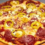The Italian Job Pizza · All beef pepperoni, salami, feta, and banana peppers.
