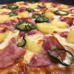 Hawaiian Punch Pizza · Canadian bacon, fresh pineapple, fresh jalapenos, and onions.
