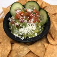 Chips N Guacamole · Fresh made guacamole topped with pico, queso fresco and cucumber.  
Served with chips.
