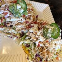 Tostada Costa · 2 tostada shells covered in refried beans and lettuce and cabbage mix. Then covered in your ...