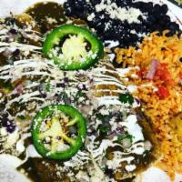 Enchiladas Chicken Verde Roasted · 2 chicken enchiladas filed with cheese and covered in roasted verde sauce.   
Topped with on...