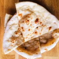 Butter Naan · Oven baked soft bread with butter spread.