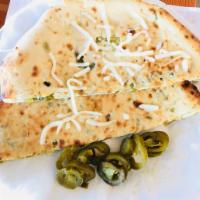 Jalapeno Cheese Naan · A twist to the traditional quintessential naan with Jalapeno and cheese stuffing gives amazi...