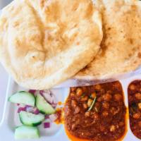 Chole Bhature · Chickpeas simmered in delicious onion and tomato gravy, along with Indian spices. It is serv...