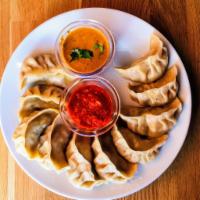 Veg Momos (6 pieces) · Popular and favorite savory made by steaming dumplings stuffed with lightly spiced vegetable...