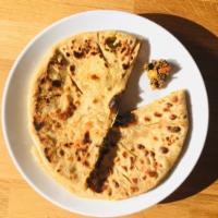 Aloo Masala Parantha · Indian flatbread with tasty filling of mashed potatoes, flavored with Indian spices. Served ...
