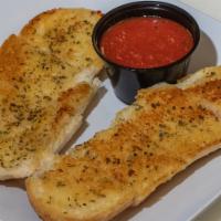 Garlic Bread · Topped with fresh garlic and herbs, served with house-made marinara (4 oz.).
