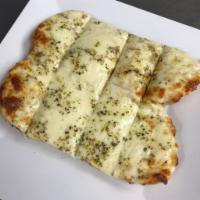Cheesy Garlic Bread · Smothered with mozzarella cheese with fresh garlic and butter.  Served with house-made marin...
