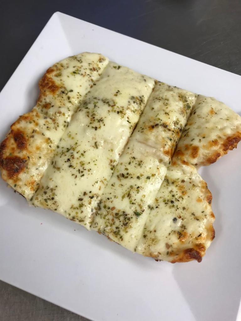 Cheesy Garlic Bread · Smothered with mozzarella cheese with fresh garlic and butter.  Served with house-made marinara (4 oz.).