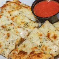 Cheesy Bread Sticks · Smothered and melted in our signature cheese blend.  Served with house-made marinara (4 oz.).